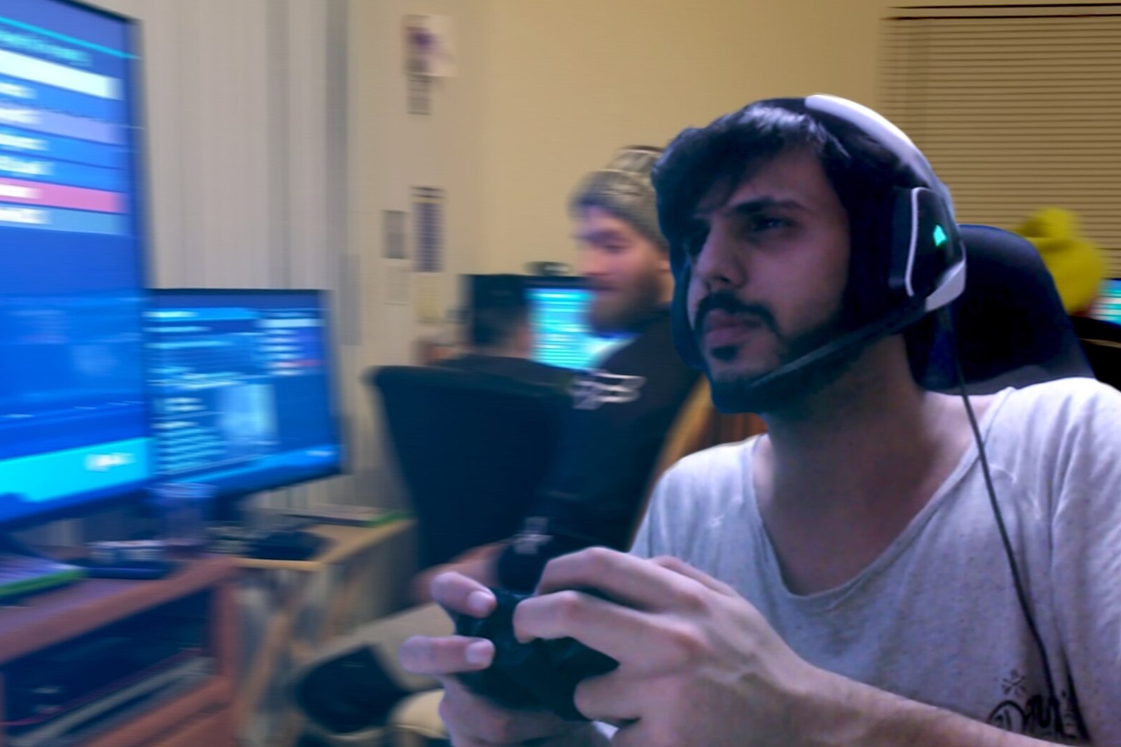 A focused player at a practice station wearing a headset, mid-session